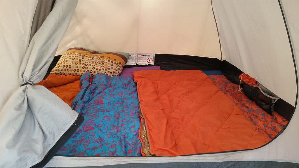 Orange Sleeping bags in tent